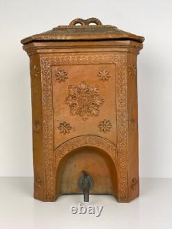 Old ceramic water fountain, terracotta, crafted in the 19th century, popular art