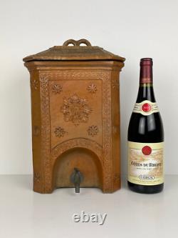 Old ceramic water fountain, terracotta, crafted in the 19th century, popular art