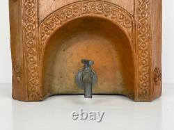 Old ceramic water fountain, terracotta, crafted in the 19th century, popular art