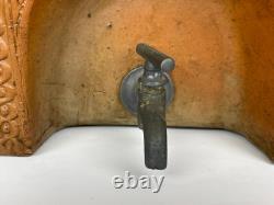 Old ceramic water fountain, terracotta, crafted in the 19th century, popular art