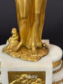 Old pair of gilt bronze candlesticks with female figure and cornucopia, 19th century