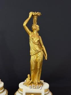 Old pair of gilt bronze candlesticks with female figure and cornucopia, 19th century
