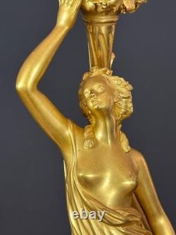 Old pair of gilt bronze candlesticks with female figure and cornucopia, 19th century