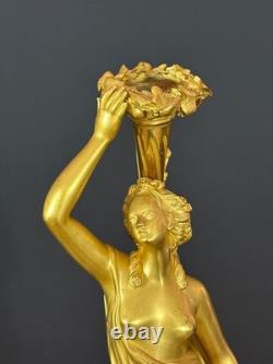 Old pair of gilt bronze candlesticks with female figure and cornucopia, 19th century