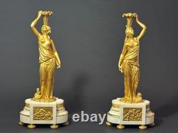 Old pair of gilt bronze candlesticks with female figure and cornucopia, 19th century
