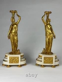 Old pair of gilt bronze candlesticks with female figure and cornucopia, 19th century