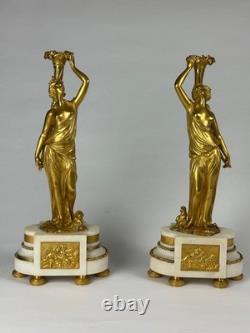 Old pair of gilt bronze candlesticks with female figure and cornucopia, 19th century
