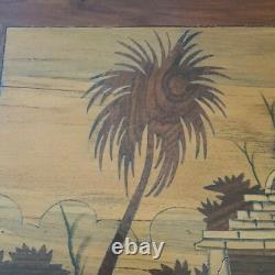 Old wooden marquetry painting of an Indian village, exotic beach, animals