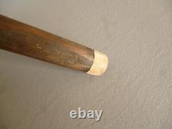 Old wooden walking stick with glove holder handle