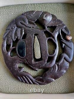 Openwork Japanese Edo period antique iron tsuba with monkey decoration in a tree