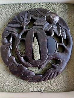 Openwork Japanese Edo period antique iron tsuba with monkey decoration in a tree