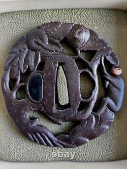 Openwork Japanese Edo period antique iron tsuba with monkey decoration in a tree