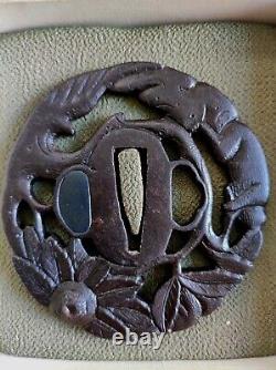 Openwork Japanese Edo period antique iron tsuba with monkey decoration in a tree