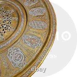 Ottoman basin in chased brass, inlaid with silver and copper Syria, late 19th century