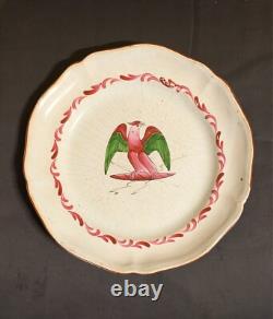 Plate in faience from the Islettes, Empire period with bird decoration