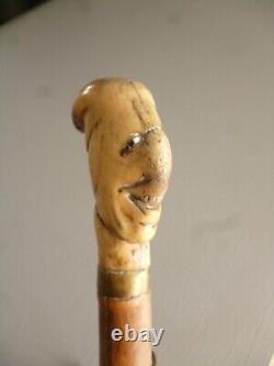 Popular Art: Antique Wooden Walking Stick with Grotesque Handle