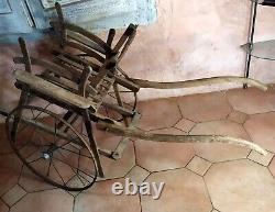 Rare children's wooden push-pull cart in popular art