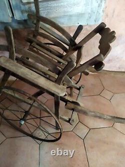 Rare children's wooden push-pull cart in popular art