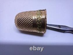 Set of 18K solid gold sewing thimble and vermeil scissors