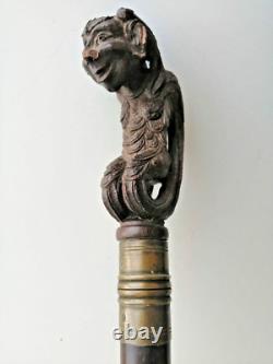 Superb antique mahogany cane with a beautiful carved knob, 19th century faun decoration