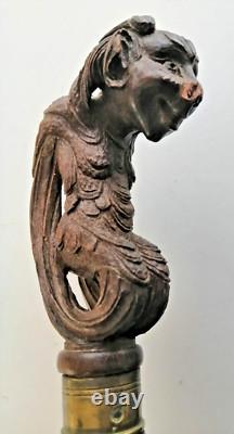 Superb antique mahogany cane with a beautiful carved knob, 19th century faun decoration