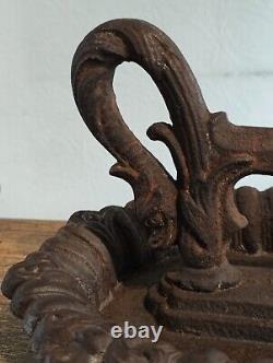 Superb cast iron boot scraper, 19th century Dolphin design