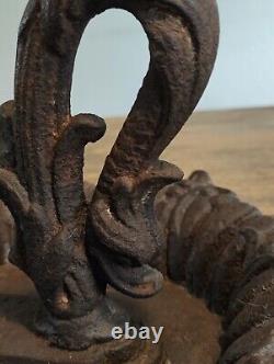 Superb cast iron boot scraper, 19th century Dolphin design