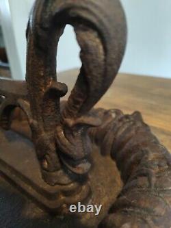 Superb cast iron boot scraper, 19th century Dolphin design