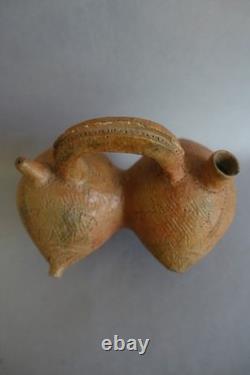 Terracotta whistling vase with incised decoration