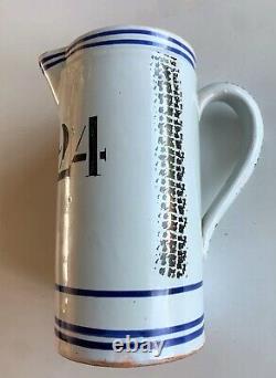 Translate this title in English: Flandre large numbered pitcher with archer, northern faience 19th century n° 24.