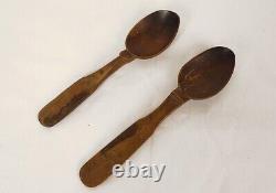 Translation: 2 Breton wooden spoons, finely carved, late 19th century to early 20th century.