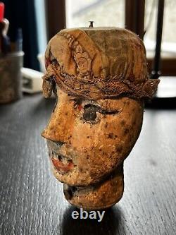 Translation: 'Head of an Ancient Marionette: Carved and Polychrome Wooden Guignol from the 19th Century'