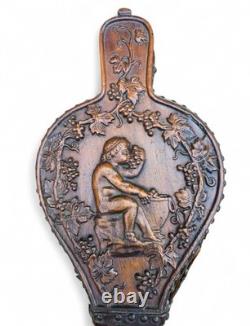 Wooden Chimney Bellows Sculpted in the Likeness of Bacchus Between Two Scrolls