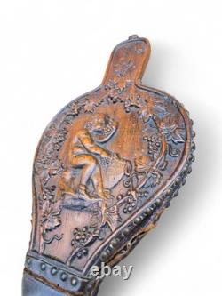 Wooden Chimney Bellows Sculpted in the Likeness of Bacchus Between Two Scrolls
