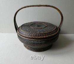 Woven bamboo and rattan basket with handle, 19th century