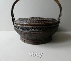 Woven bamboo and rattan basket with handle, 19th century