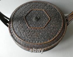 Woven bamboo and rattan basket with handle, 19th century
