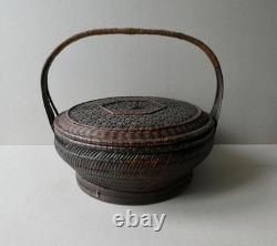 Woven bamboo and rattan basket with handle, 19th century