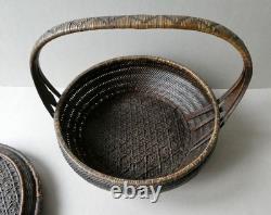 Woven bamboo and rattan basket with handle, 19th century