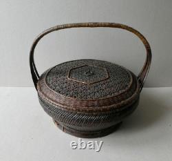 Woven bamboo and rattan basket with handle, 19th century
