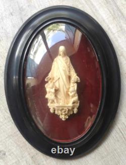 ANCIEN RELICAIRE Cadre ovale en bois Napoléon III noirci, et verre bombé