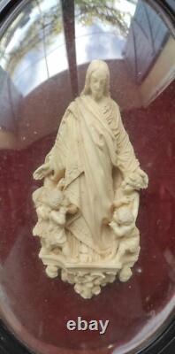 ANCIEN RELICAIRE Cadre ovale en bois Napoléon III noirci, et verre bombé