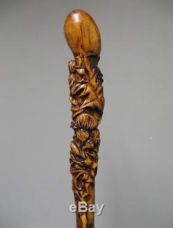 Ancien bâton de marche en bois sculpté. Chardons. Art populaire