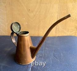 Ancien petit arrosoir en cuivre à grand bec fin