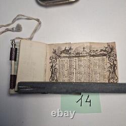 Carnet de 1840 avec calendrier + un porte monnaie gravé à l'initial LOT 14
