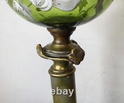 Grande lampe à pétrole, bronze et onyx toupie décor émaillé